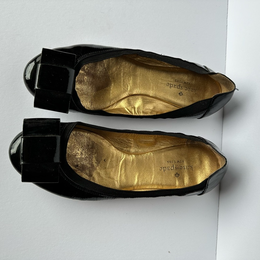 Kate Spade shiny black flats with a bow